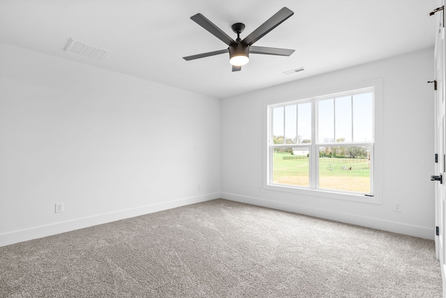 unfurnished room featuring carpet floors and ceiling fan