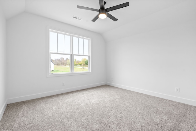 bonus room with lofted ceiling and carpet