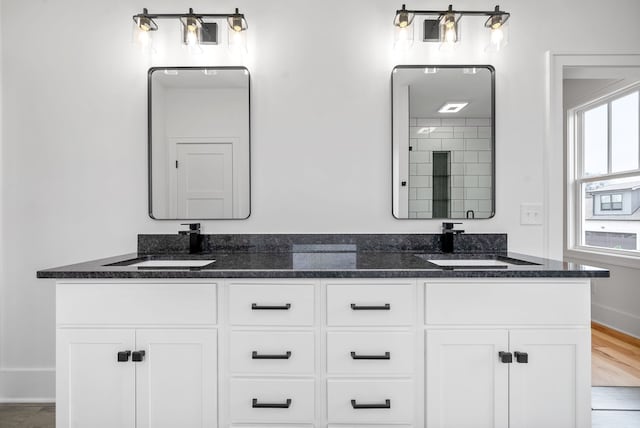 bathroom with vanity and hardwood / wood-style flooring