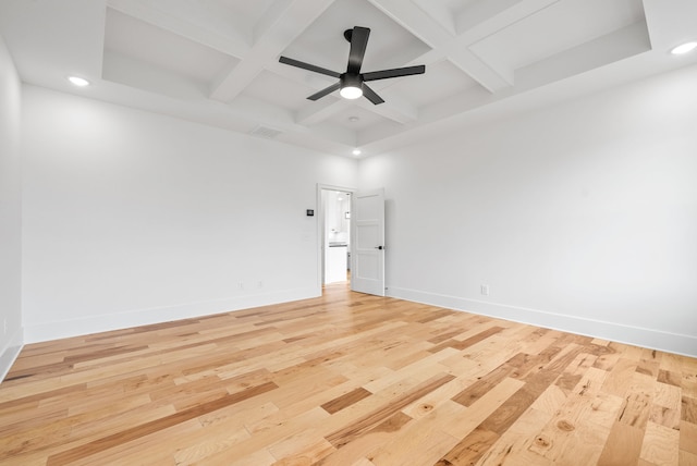 unfurnished room featuring coffered ceiling, ceiling fan, and light hardwood / wood-style flooring