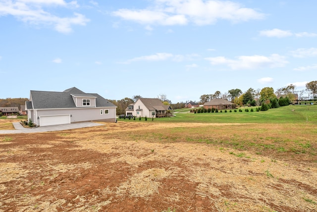 view of yard with a garage