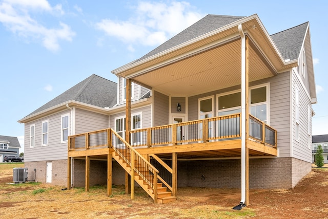 back of property featuring cooling unit and a deck