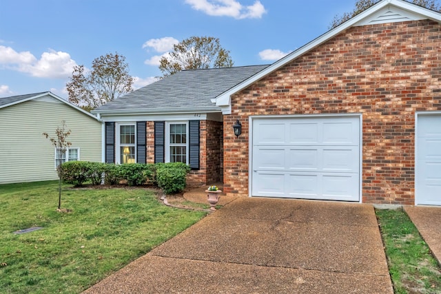 view of front facade featuring a garage and a front lawn