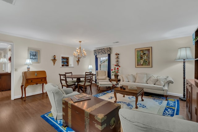 living room with dark wood-type flooring, a chandelier, and crown molding