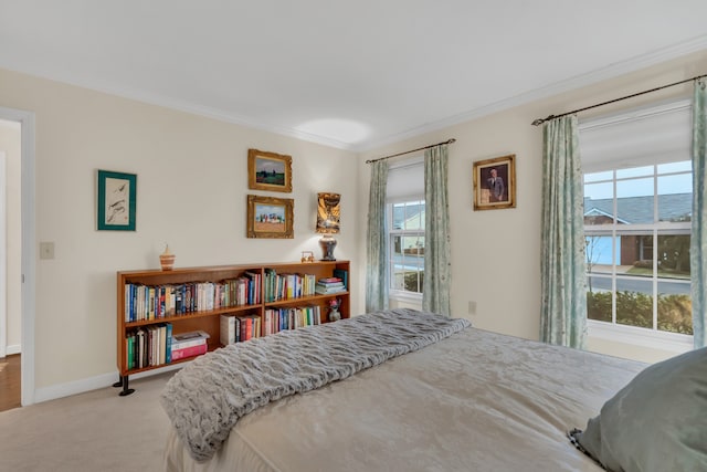 carpeted bedroom featuring ornamental molding