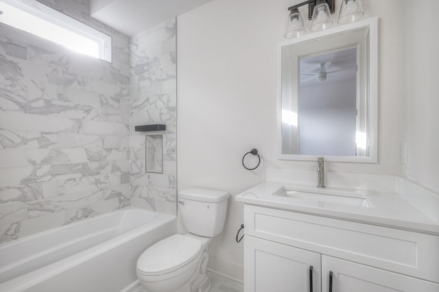 full bathroom featuring vanity, toilet, and tiled shower / bath combo