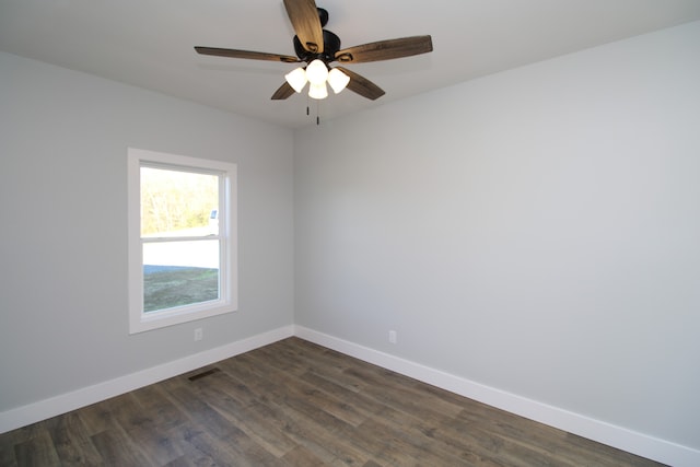 unfurnished room featuring ceiling fan and dark hardwood / wood-style floors