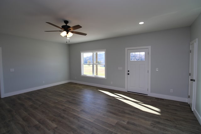 entryway with dark hardwood / wood-style flooring and ceiling fan