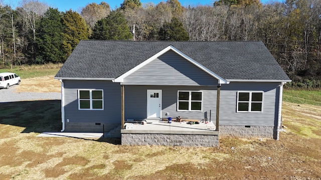 view of front of property with a front yard and a patio area