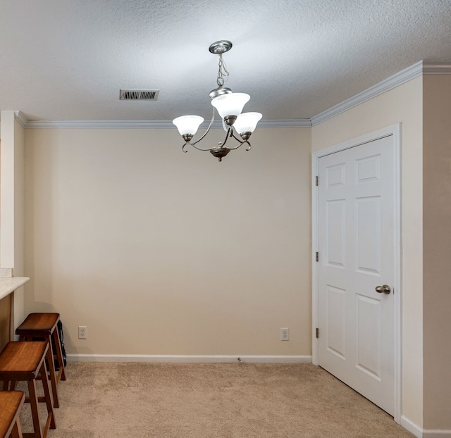 dining area with light carpet, ornamental molding, and a notable chandelier