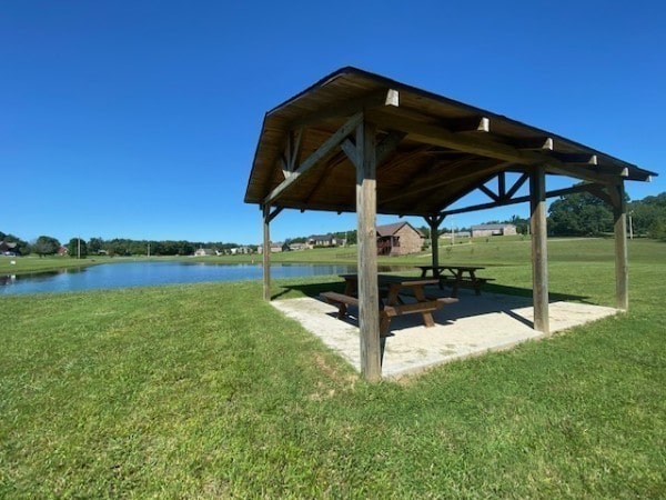 view of yard featuring a water view and a gazebo