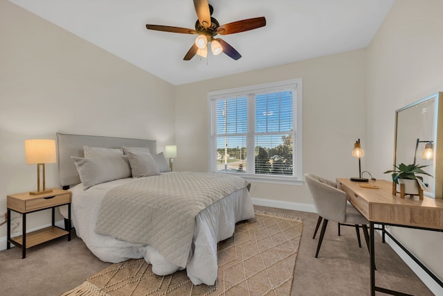 bedroom with ceiling fan and light carpet