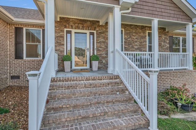 doorway to property with covered porch