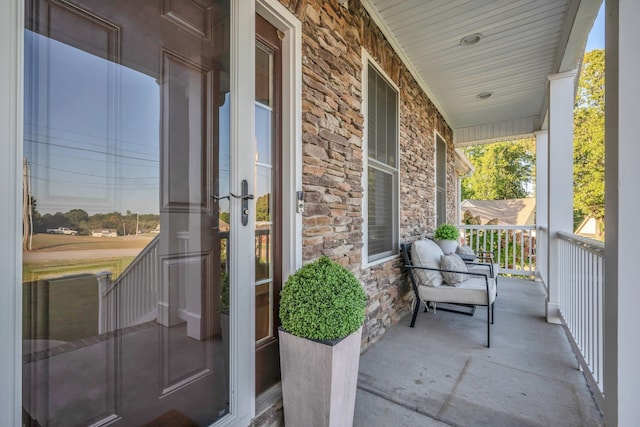 balcony featuring a porch