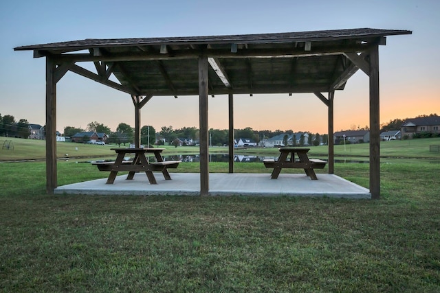 view of community featuring a patio and a yard