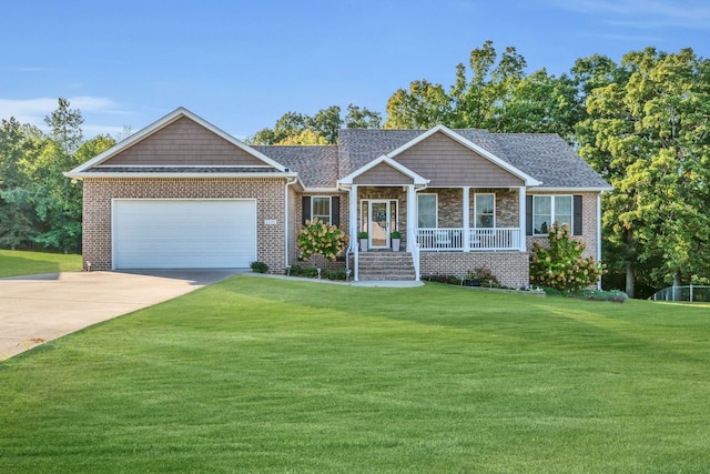 view of front of property with a garage, a porch, and a front lawn