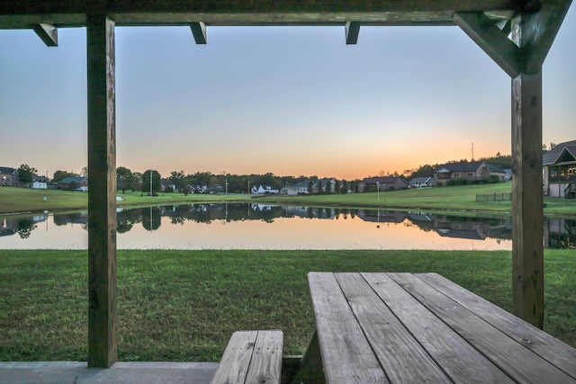 yard at dusk with a water view