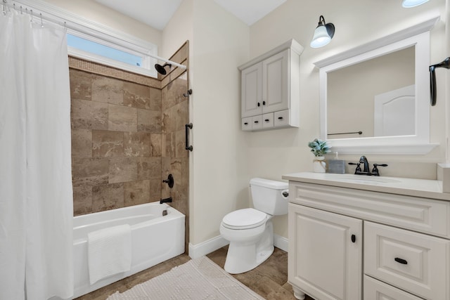 full bathroom with vanity, hardwood / wood-style flooring, toilet, and shower / tub combo