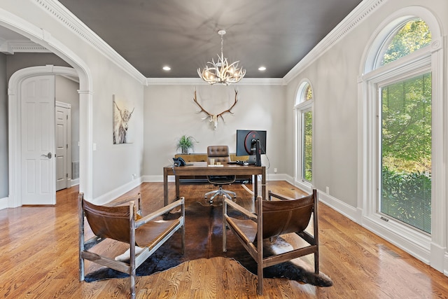 office featuring ornamental molding, light hardwood / wood-style floors, and a chandelier