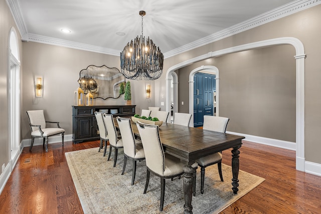 dining room featuring dark hardwood / wood-style floors and crown molding