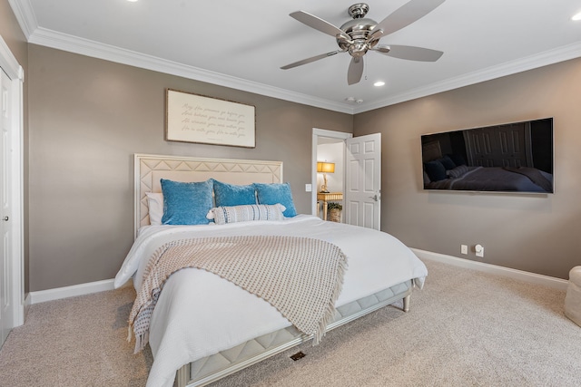 bedroom with light colored carpet, ceiling fan, and crown molding