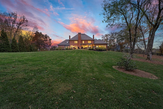 view of yard at dusk