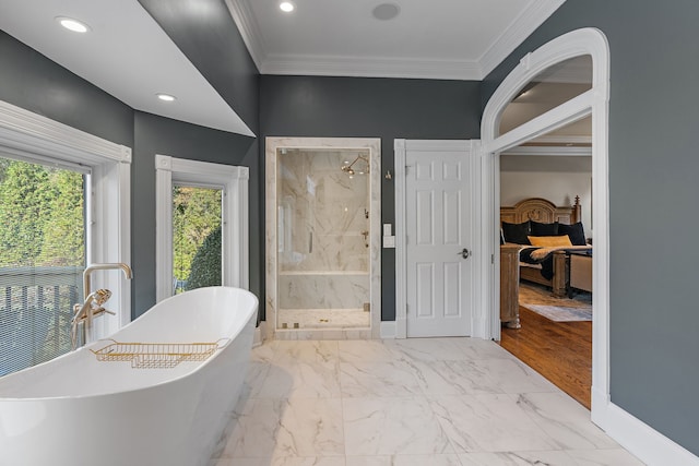 bathroom featuring hardwood / wood-style flooring, plus walk in shower, and crown molding