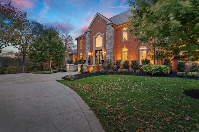 view of front of house with a lawn