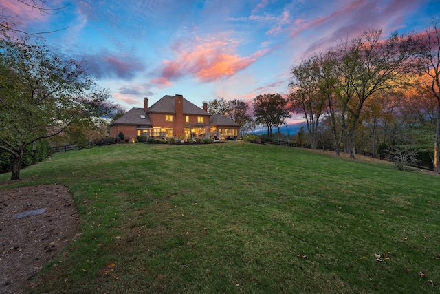 view of yard at dusk