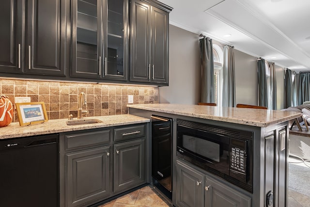 kitchen with black appliances, light stone countertops, sink, and ornamental molding