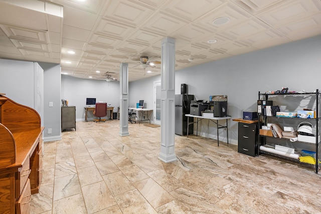 basement featuring ceiling fan and stainless steel fridge