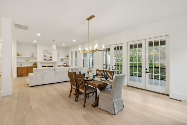 dining area with light wood-style floors, recessed lighting, french doors, and visible vents