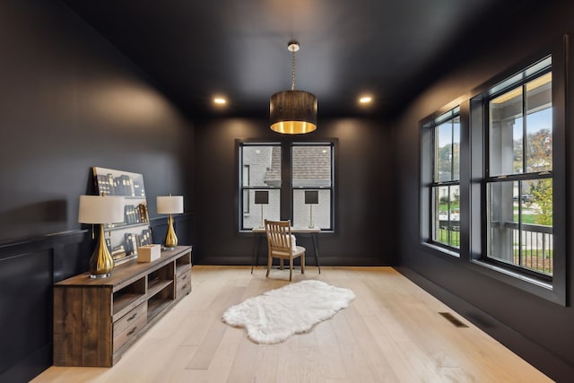 sitting room with recessed lighting, visible vents, and wood finished floors