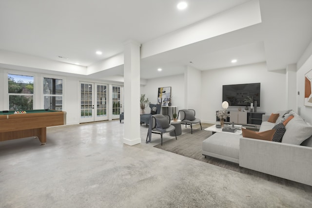 living area with visible vents, concrete floors, baseboards, recessed lighting, and french doors