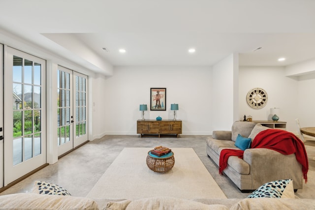 living room featuring plenty of natural light and french doors