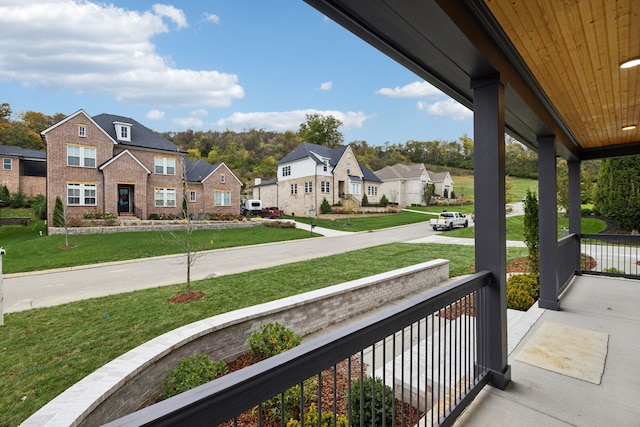 balcony with a residential view and covered porch