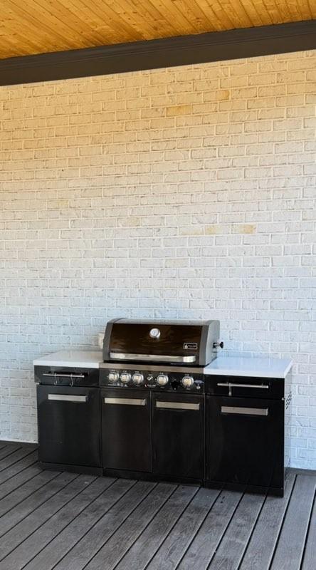 wooden terrace with grilling area and area for grilling