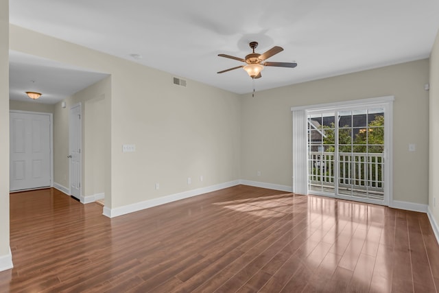 unfurnished room featuring dark hardwood / wood-style flooring and ceiling fan