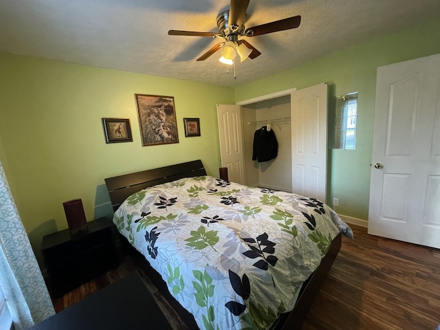 bedroom with dark hardwood / wood-style flooring, a closet, a textured ceiling, and ceiling fan