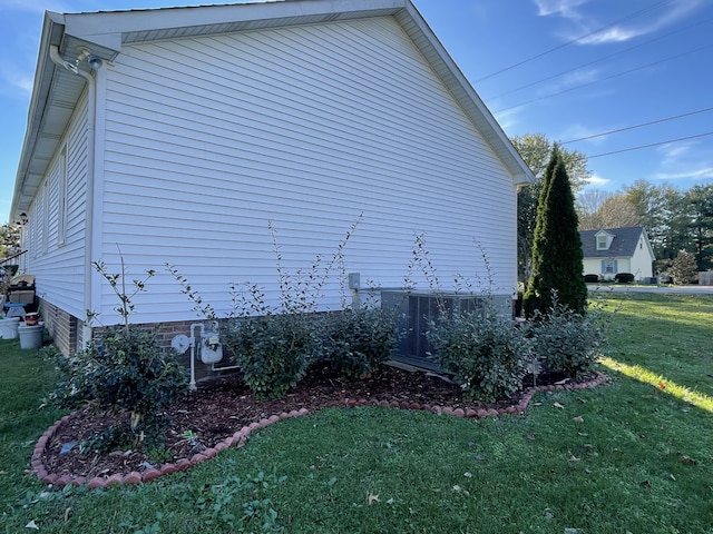 view of property exterior featuring a lawn