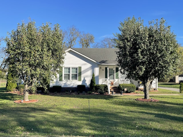 view of front of property featuring covered porch and a front yard