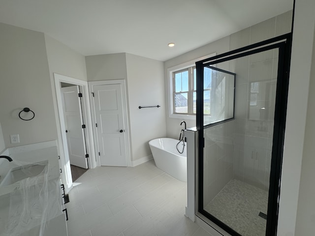 bathroom with sink and plus walk in shower