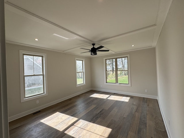 spare room with ceiling fan, a healthy amount of sunlight, dark hardwood / wood-style flooring, and ornamental molding