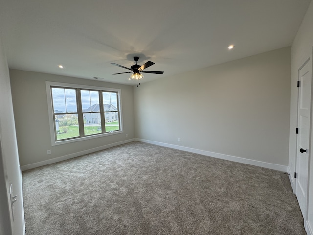 carpeted empty room with ceiling fan