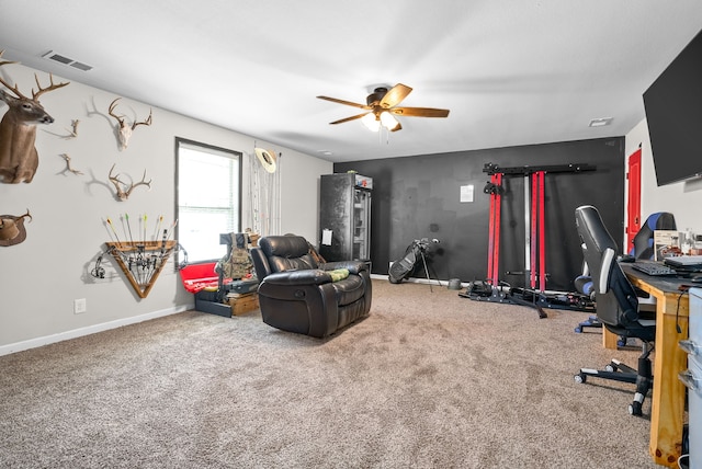 interior space with carpet floors and ceiling fan