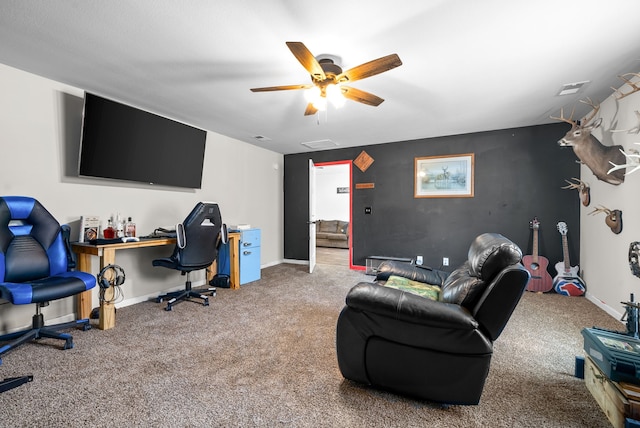 interior space featuring ceiling fan and carpet