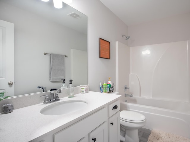 full bathroom featuring shower / washtub combination, vanity, and toilet