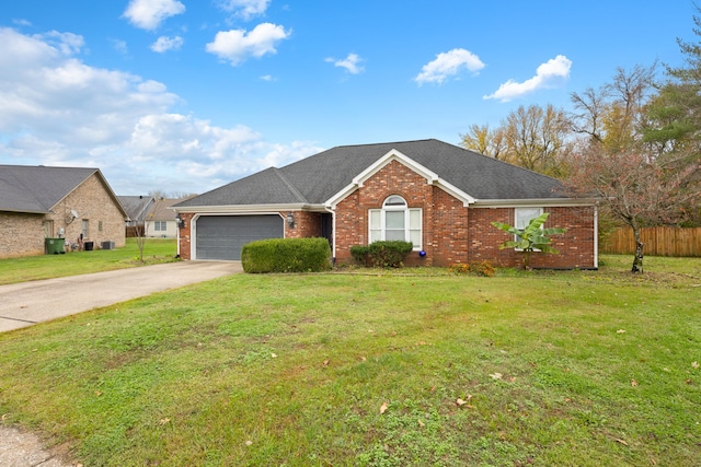 single story home with a front yard and a garage