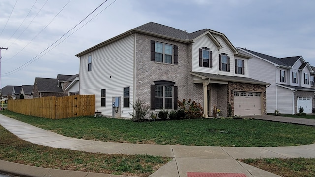 view of front of house featuring a garage and a front yard