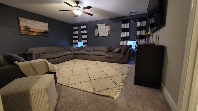 carpeted living room featuring ceiling fan